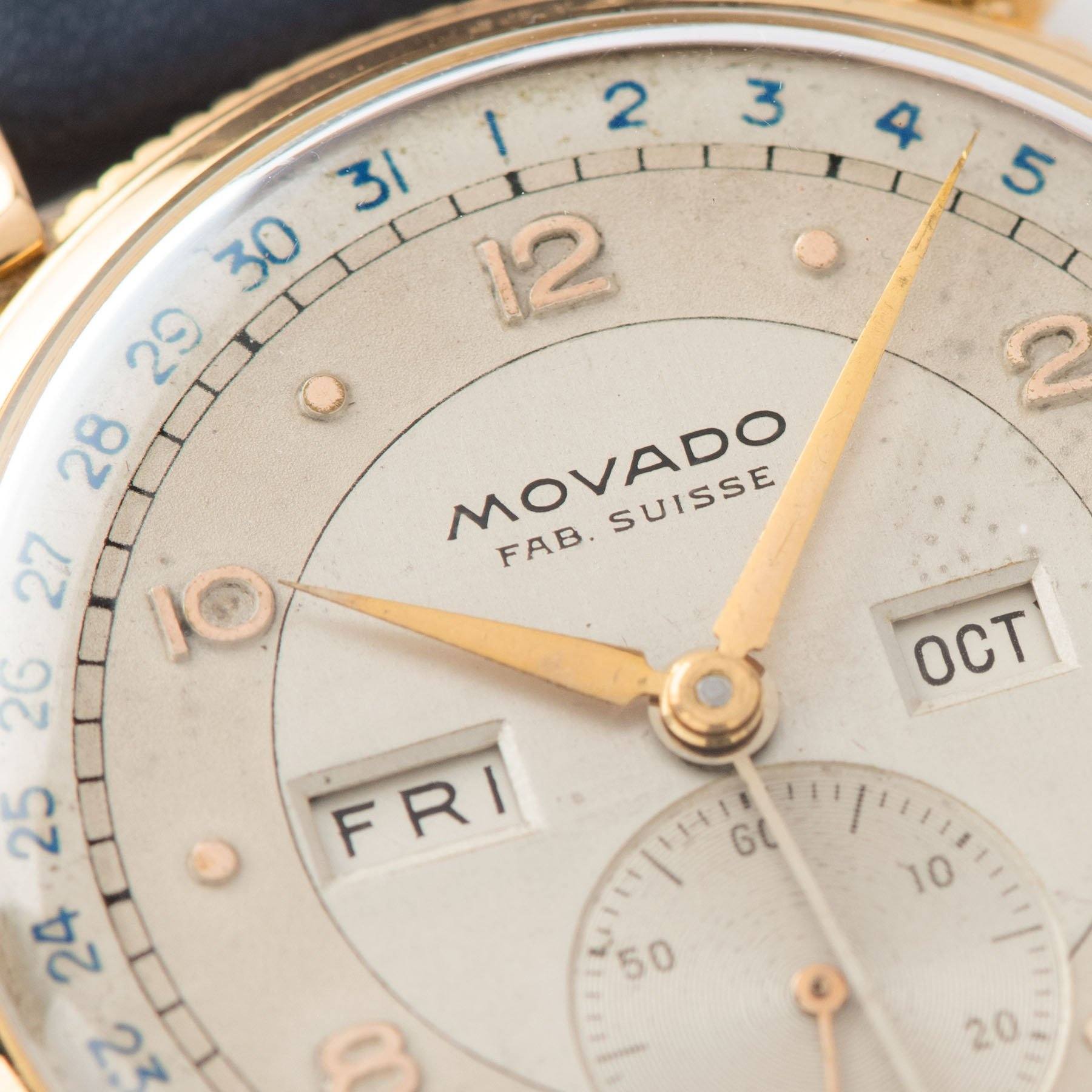Movado Triple Calendar Pink Gold Dress Watch with blue date track