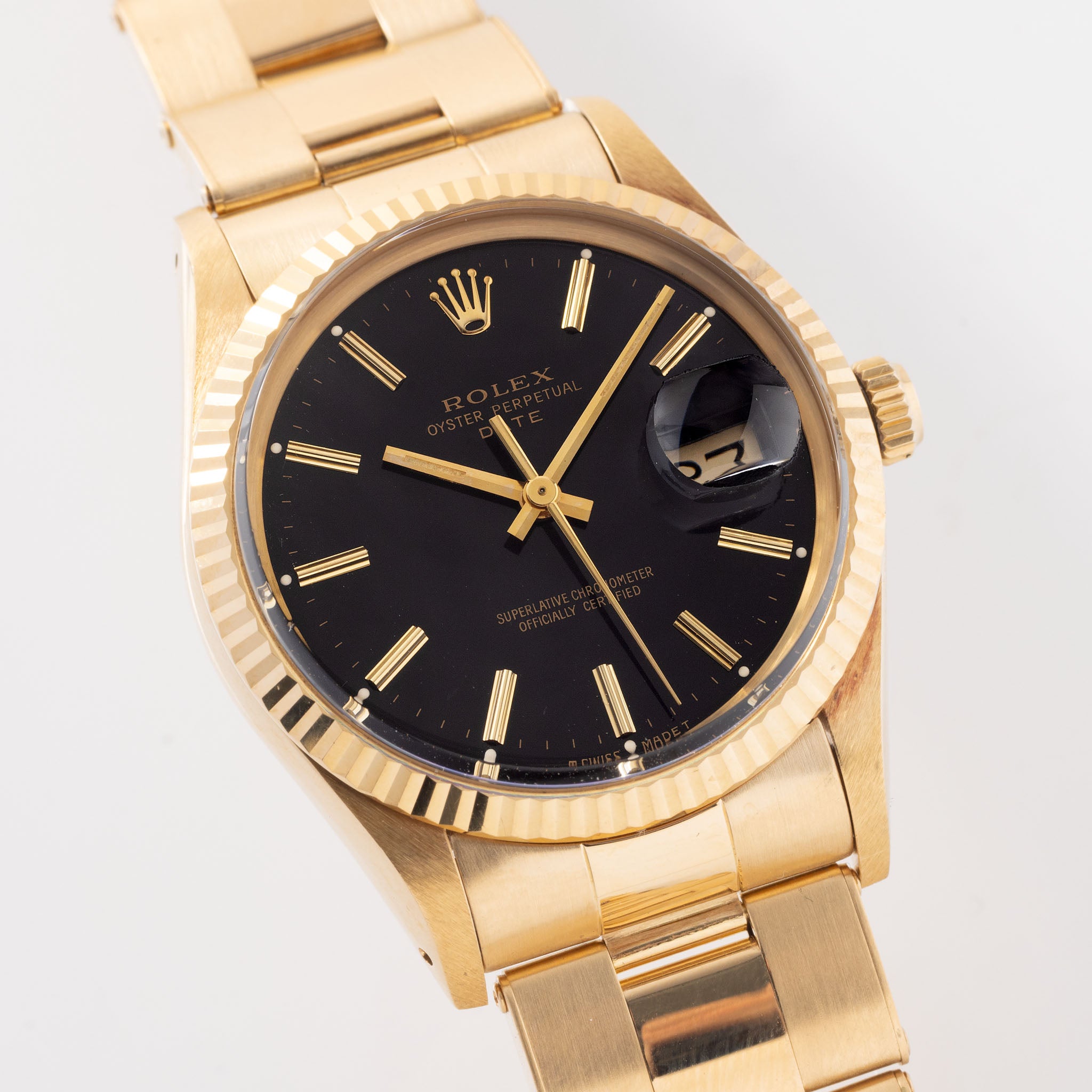 Rolex Oyster-perpetual date black dial in 18 k yellow gold ref 15038