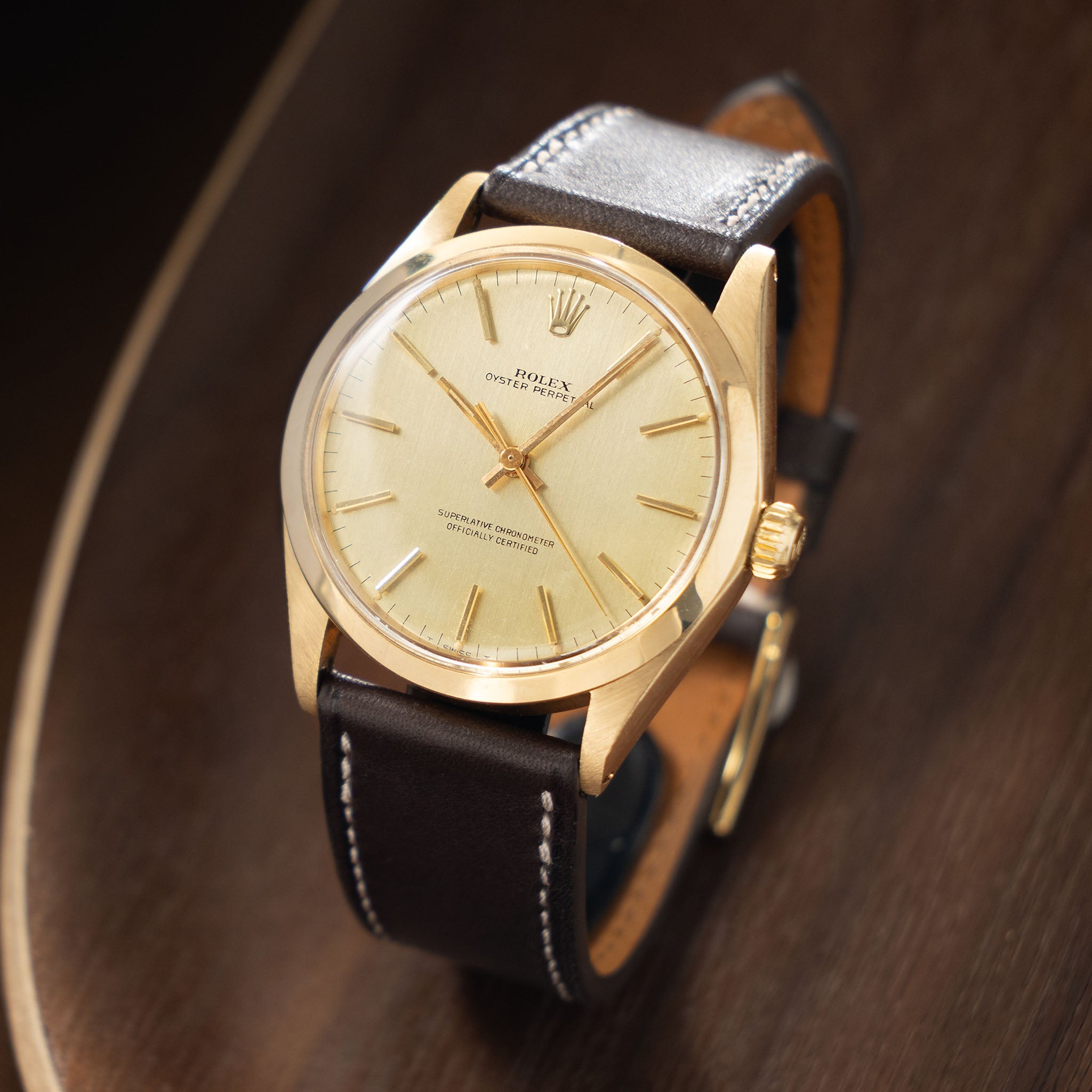 Rolex Oyster Perpetual 1002 Vertical Brush Champagne Dial in 18k Yello