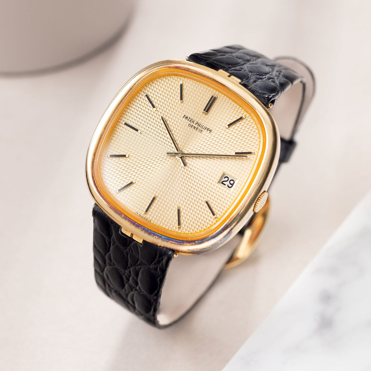 Patek Philippe Golden Ellipse Ref. 3604 TV Screen in 18k yellow Gold Champagne Clous de Paris Dial with Original Papers