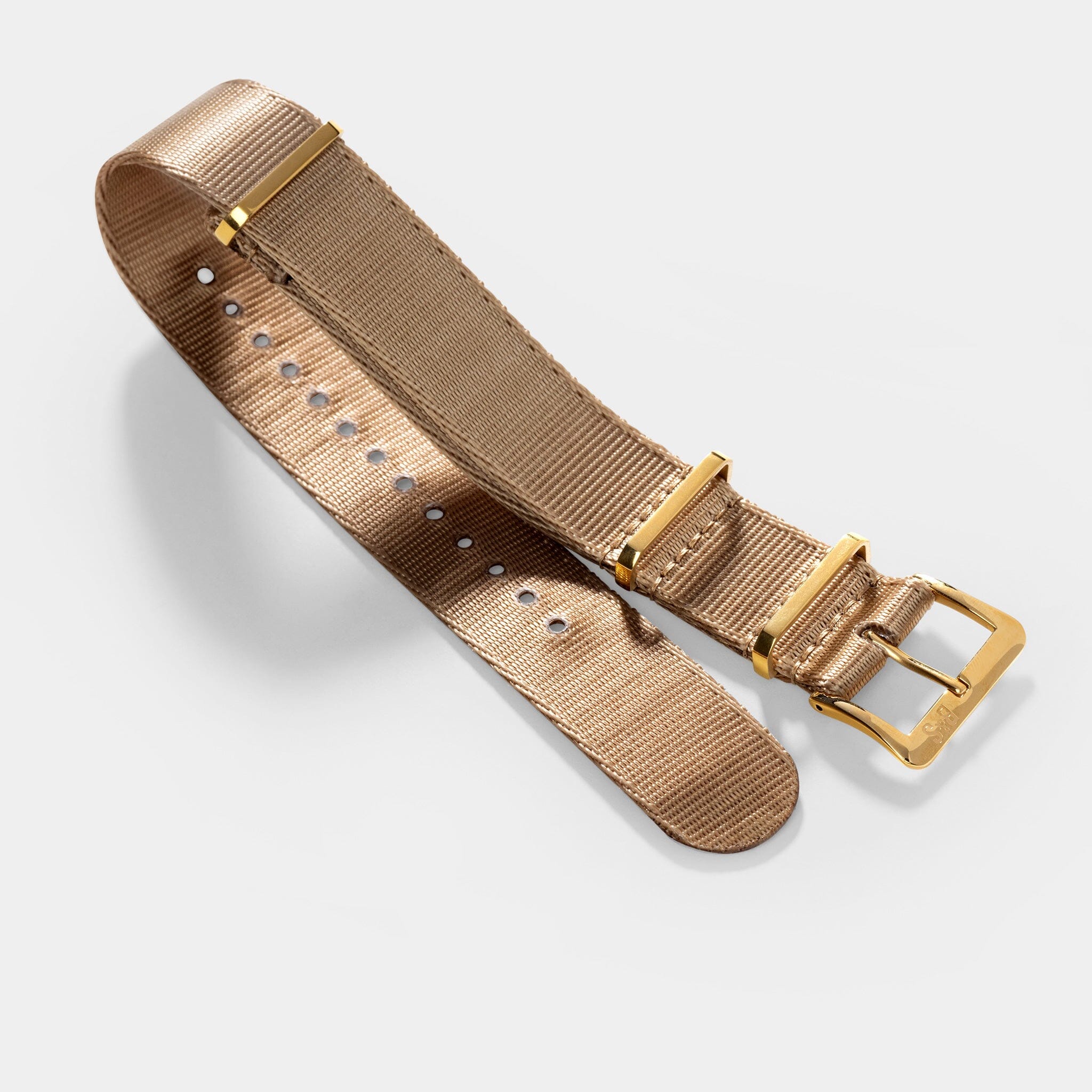 http://bulangandsons.com/cdn/shop/products/Deluxe-Nylon-Nato-Watch-Strap-Coyote-Brown---Gold_002.jpg?v=1680807353&width=2048