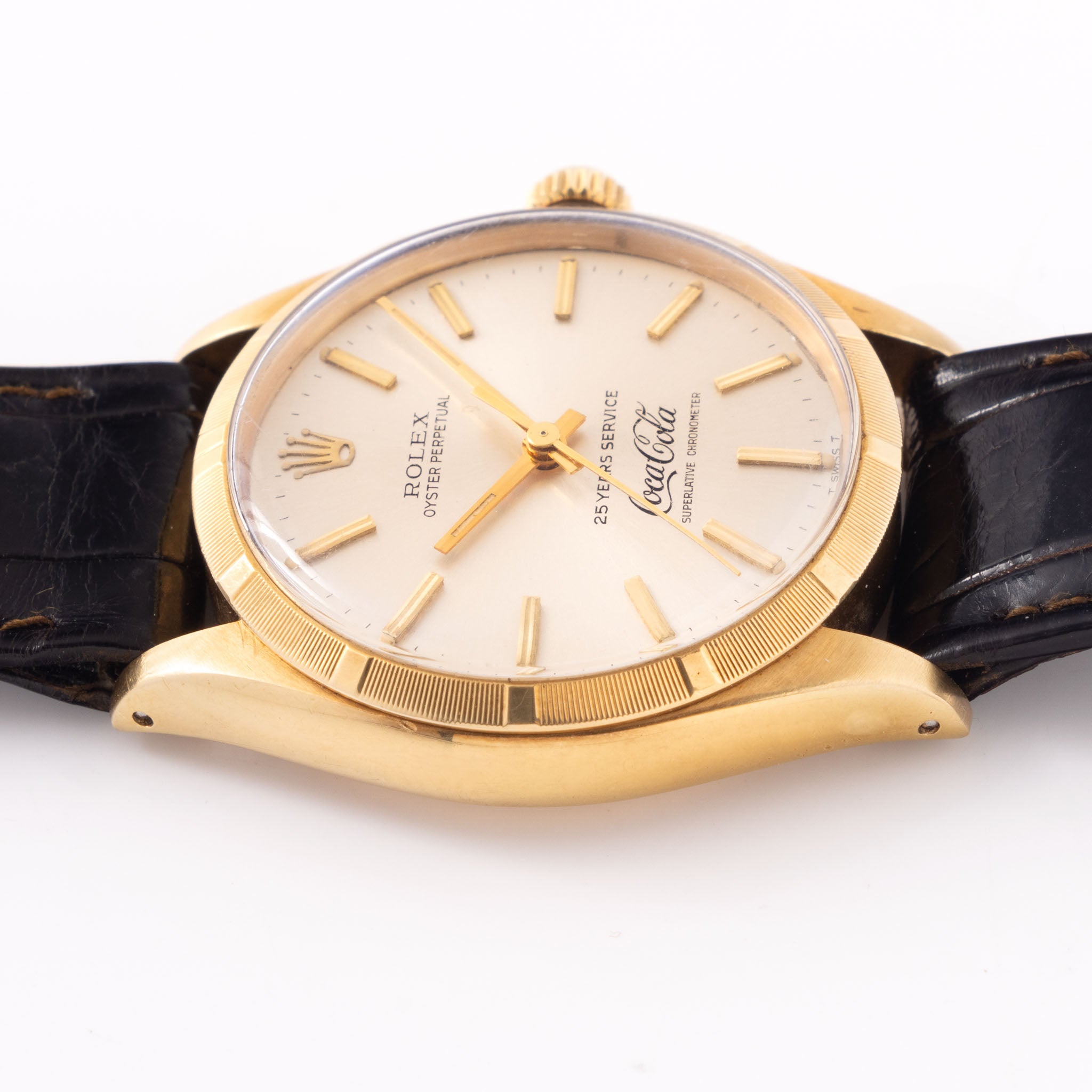 Rolex Oyster -Perpetual  silver "25 years Coca Cola service " logo dial   in 18 k yellow gold  with original double punched papers ref 1003