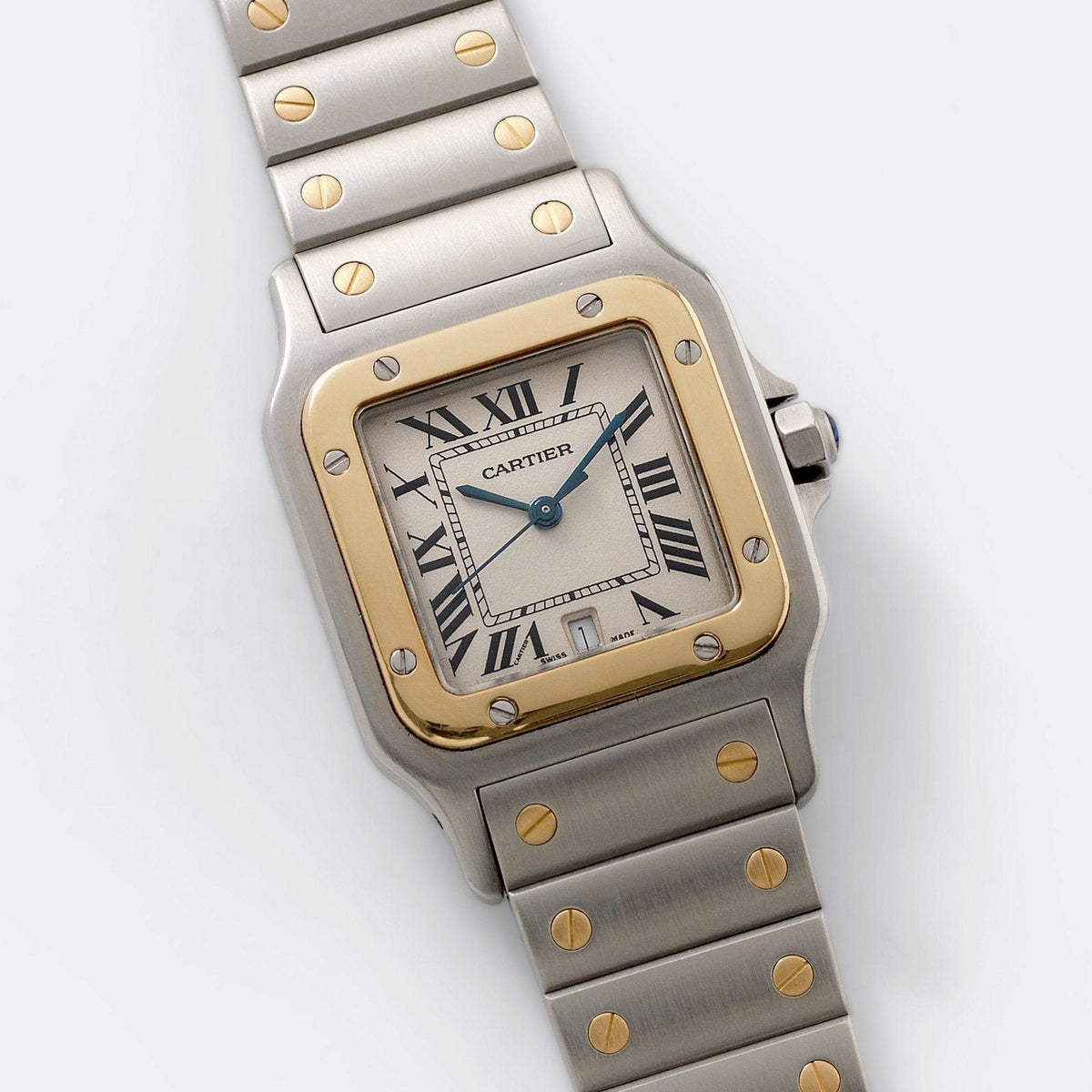 Two-tone quartz Santos Galbée shown on its pouch, white Roman dial with blued hands and date. · Photo: Bulang & Sons · © Bulang & Sons, used with permission · Source: https://bulangandsons.com/products/cartier-santos-steel-and-gold-reference-1566-w1597
