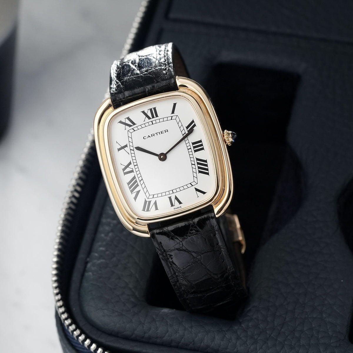 Cartier Paris Gondole Jumbo Verticale ref. 97050 in 18k yellow gold, white Roman Paris dial and blued hands. · Photo: Bulang & Sons · © Bulang & Sons, used with permission · Source: https://bulangandsons.com/products/cartier-gondole-verticale-jumbo-box-and-service-card-w2035