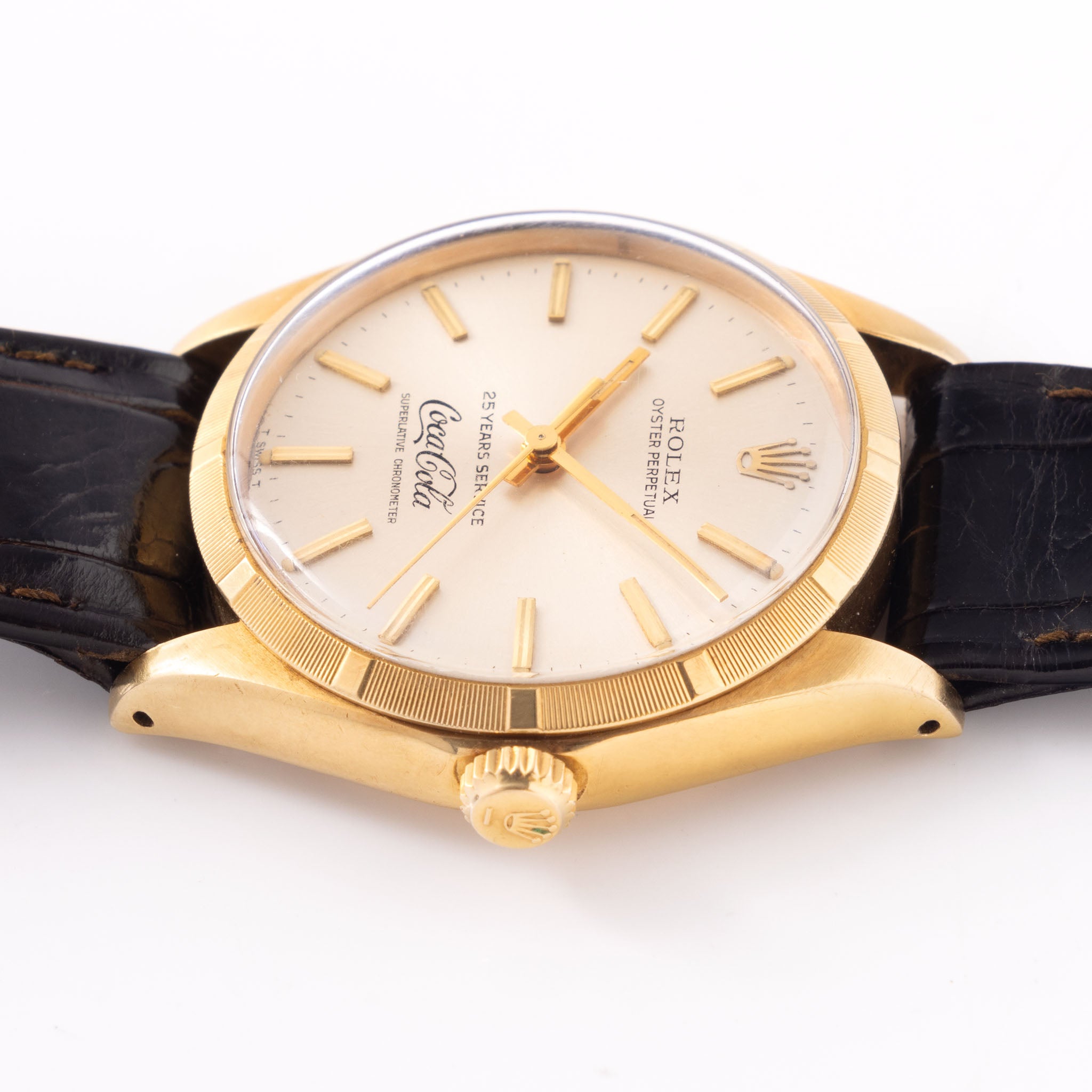 Rolex Oyster -Perpetual  silver "25 years Coca Cola service " logo dial   in 18 k yellow gold  with original double punched papers ref 1003