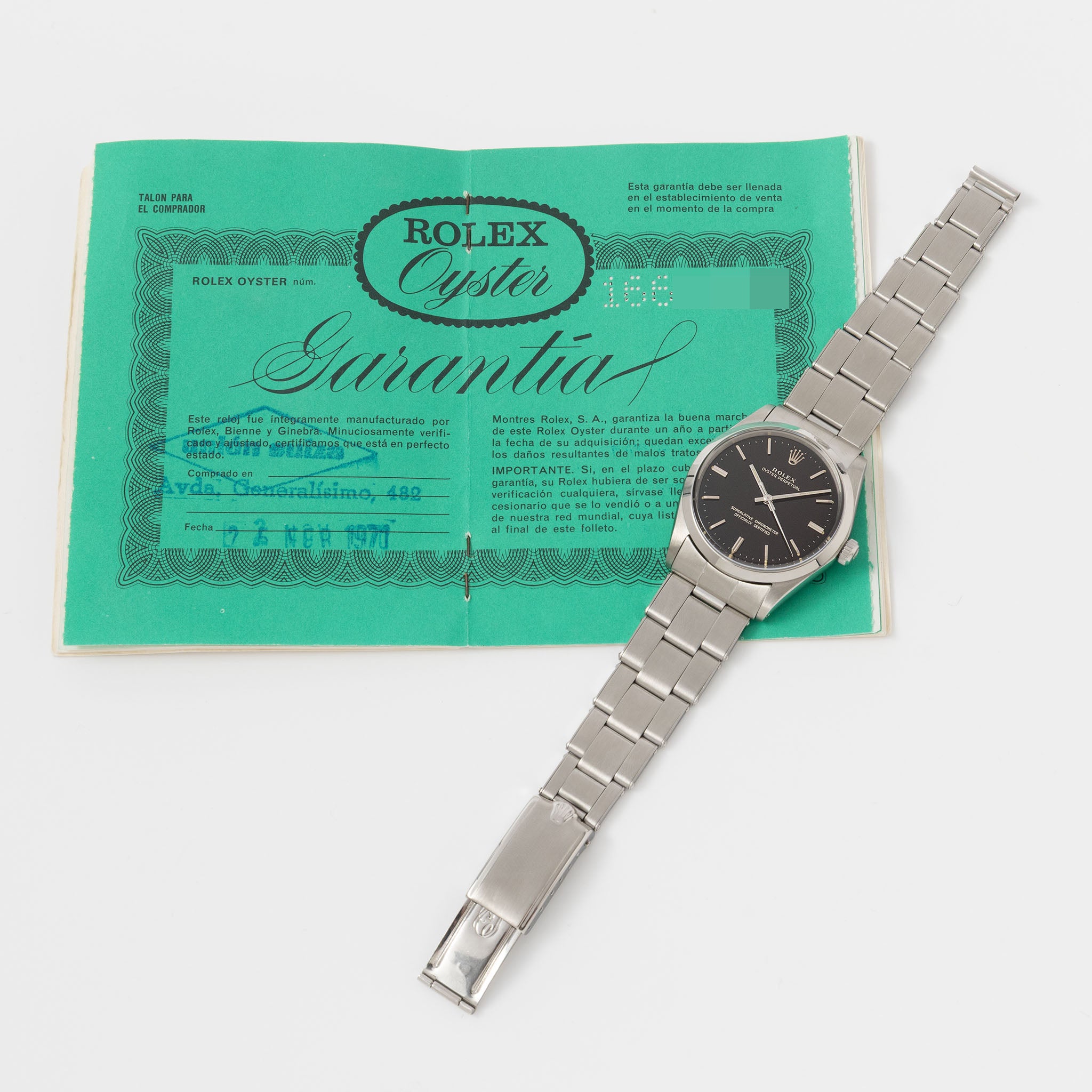 Rolex Oyster Perpetual 1002 "Burgundy Tropical Gilt Dial" with punched paper