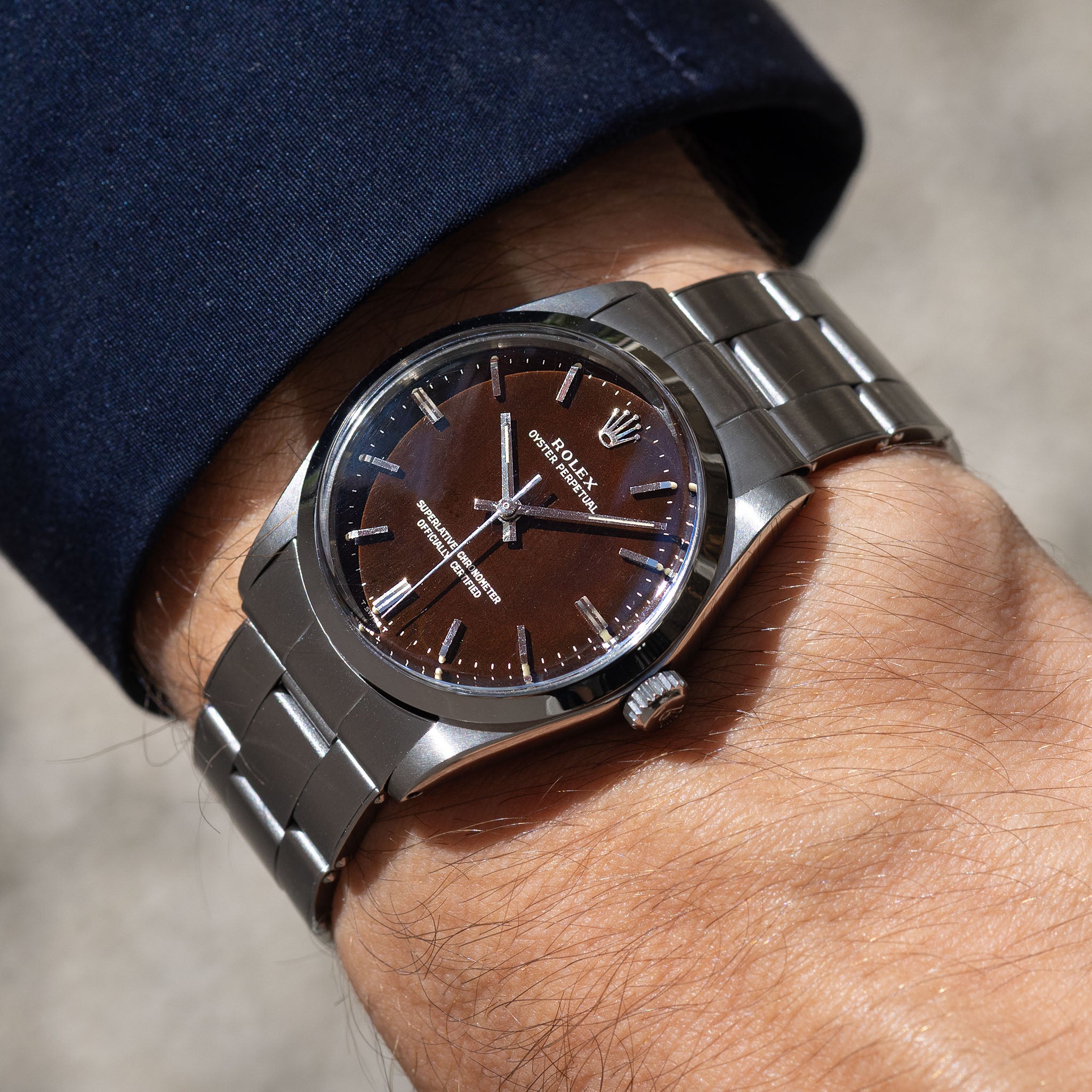 Rolex Oyster Perpetual 1002 "Burgundy Tropical Gilt Dial" with punched paper