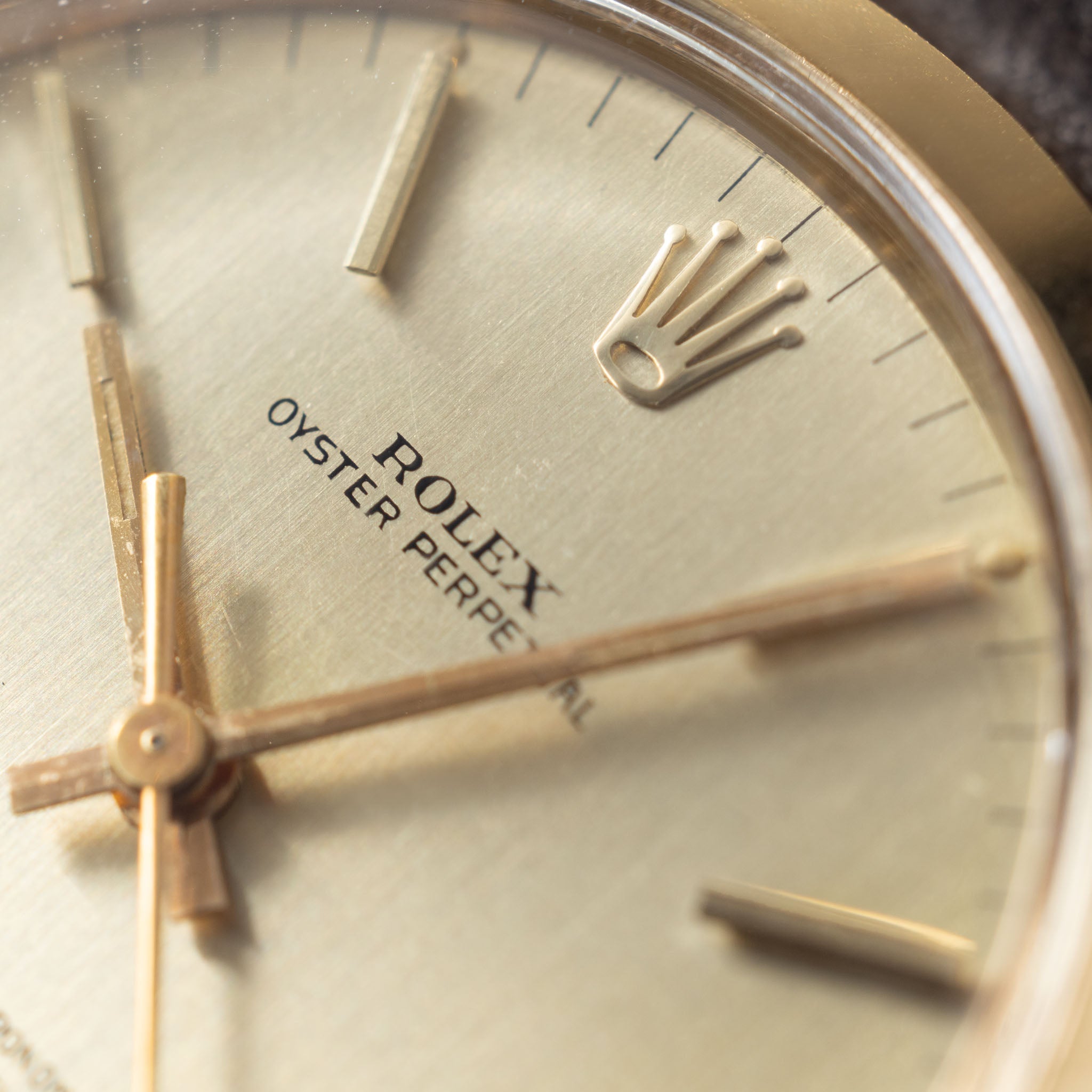 Rolex Oyster Perpetual 1002 Vertical Brush Champagne Dial in 18k Yello