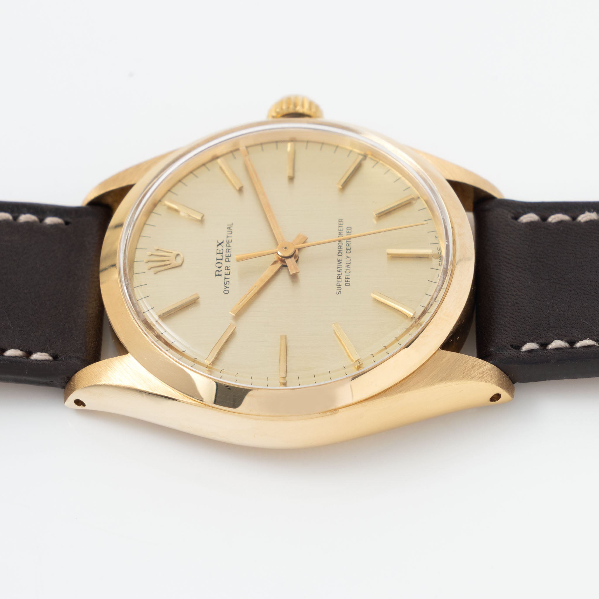 Rolex Oyster Perpetual 1002 Vertical Brush Champagne Dial in 18k Yello