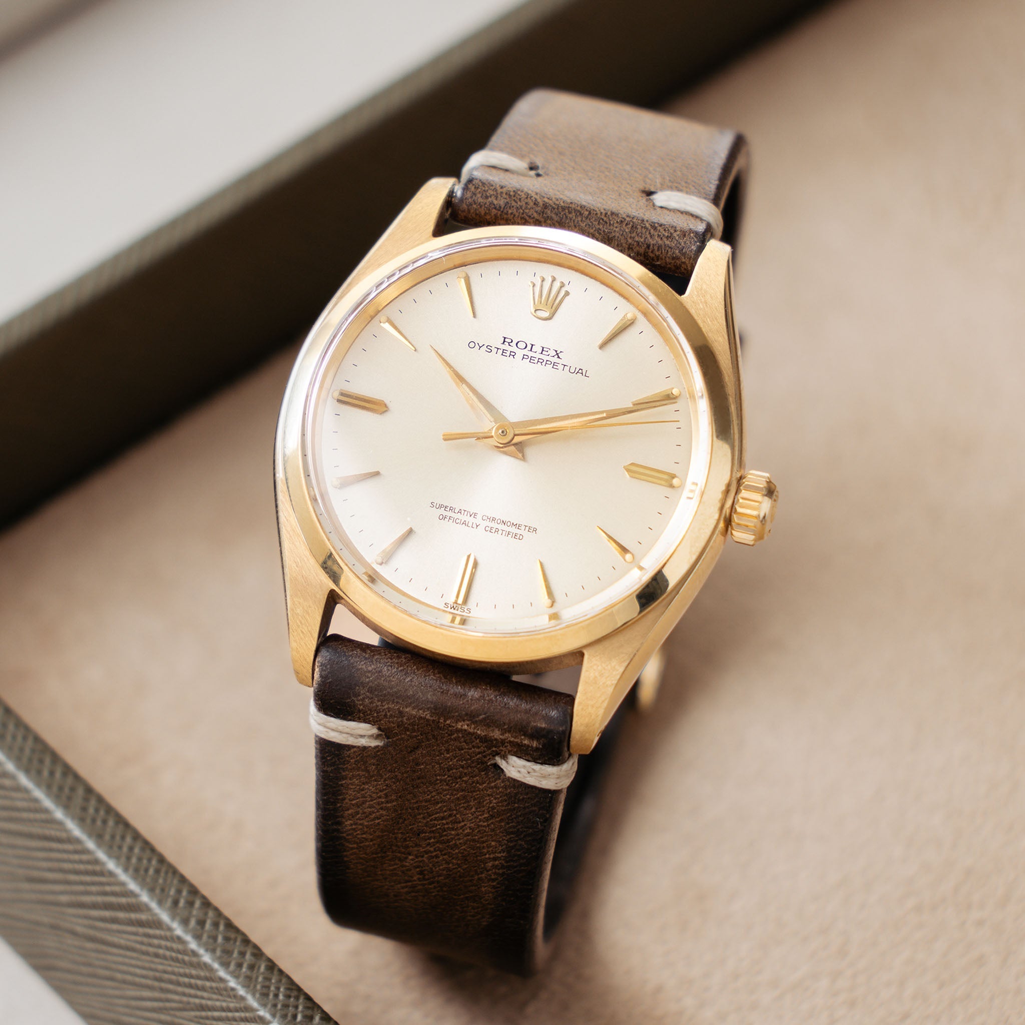 Rolex Oyster Perpetual 1002 Silver Soleil Swiss Only Dial in 18 k yellow gold Coca Cola