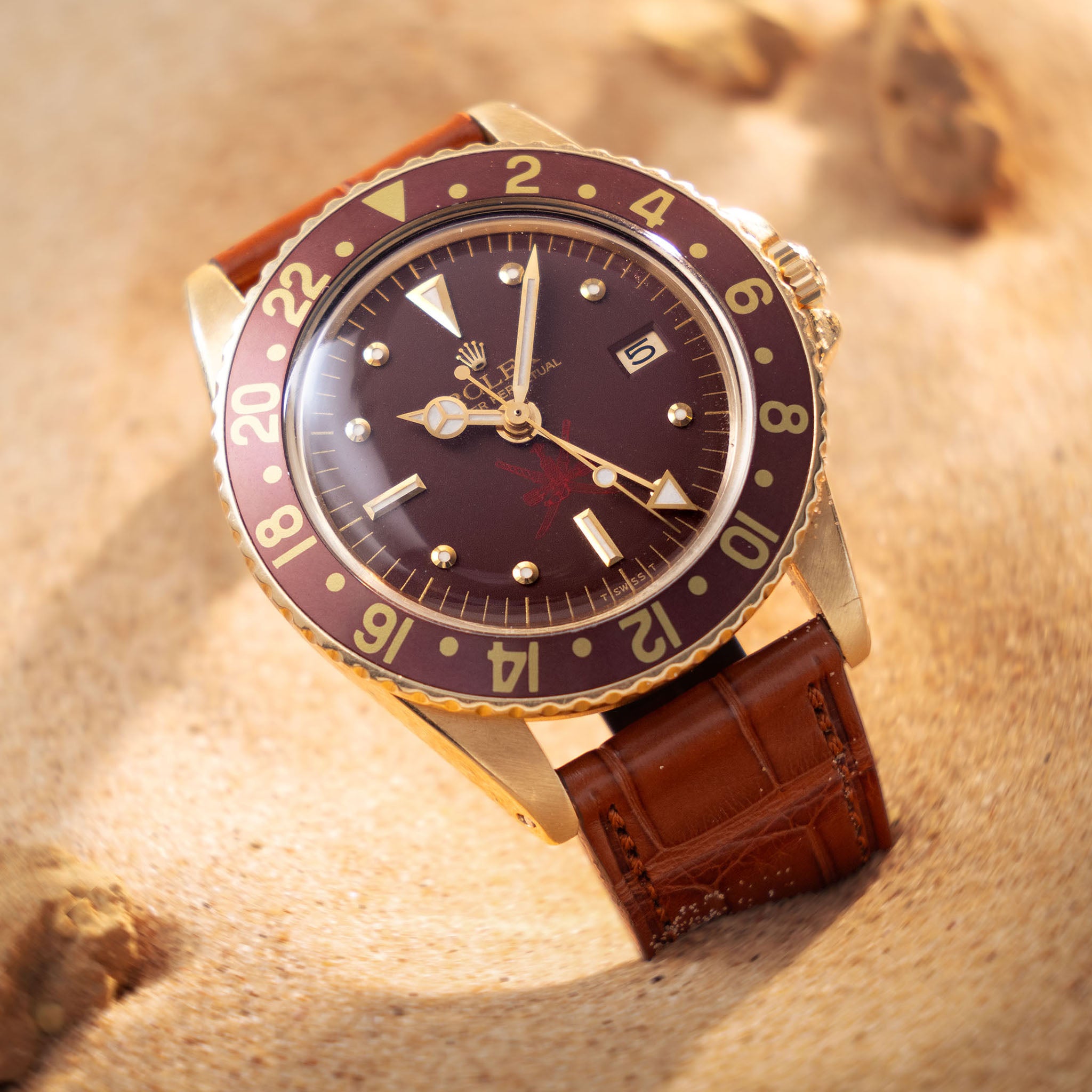 Rolex 1675/8 — Brown Nipple Dial, Large Khanjar. Photographed dealer specimen. Service papers do not establish an original commission. Documented example: 1974. Production span has not been established. · Photo: Bulang & Sons · © Bulang & Sons, used with permission · Source: https://bulangandsons.com/products/rolex-gmt-master-1675-8-unqiue-brown-khanjar-nipple-dial-with-rolex-service-papers-w3702