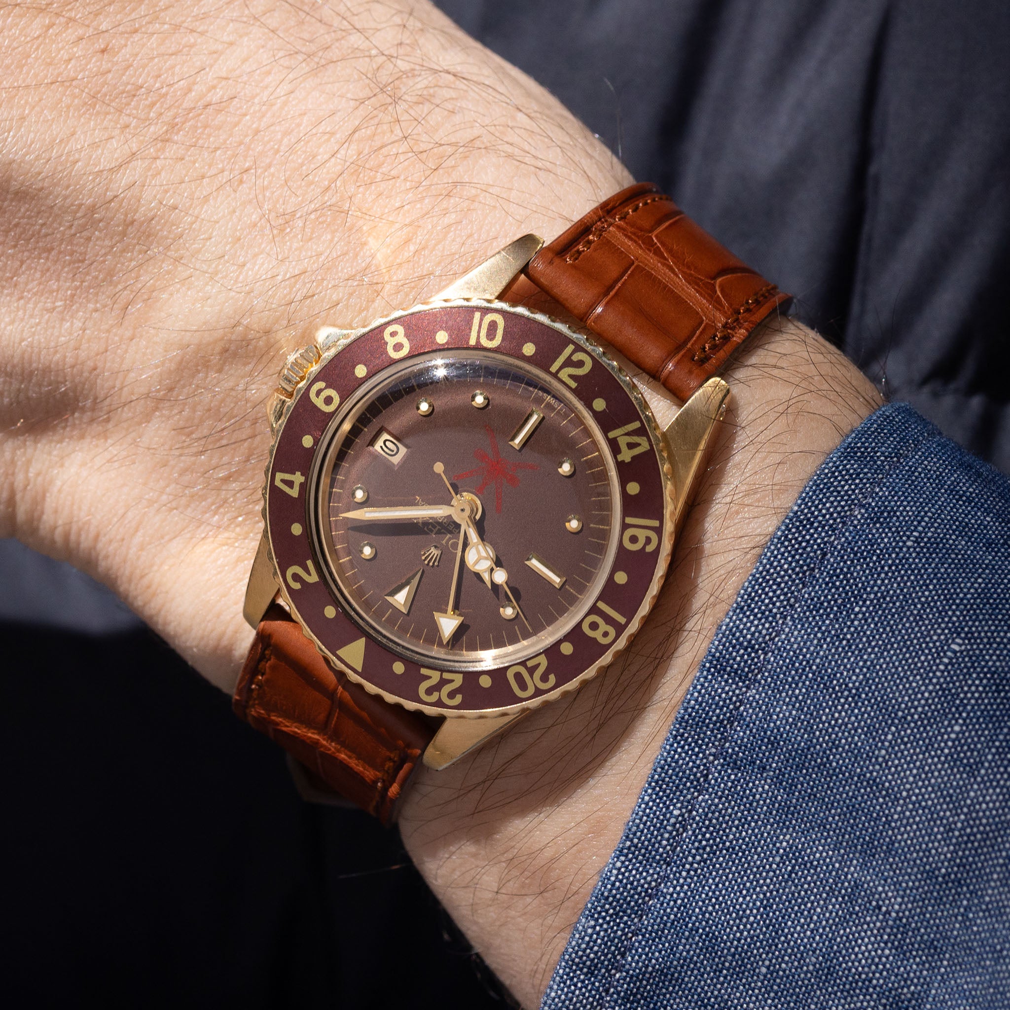 Rolex 1675/8 — Brown Nipple Dial, Large Khanjar. Photographed dealer specimen. Service papers do not establish an original commission. Documented example: 1974. Production span has not been established. · Photo: Bulang & Sons · © Bulang & Sons, used with permission · Source: https://bulangandsons.com/products/rolex-gmt-master-1675-8-unqiue-brown-khanjar-nipple-dial-with-rolex-service-papers-w3702