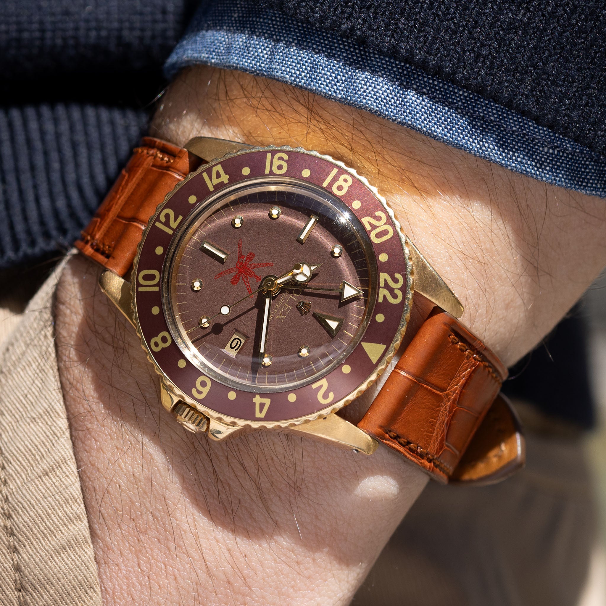 Rolex 1675/8 — Brown Nipple Dial, Large Khanjar. Photographed dealer specimen. Service papers do not establish an original commission. Documented example: 1974. Production span has not been established. · Photo: Bulang & Sons · © Bulang & Sons, used with permission · Source: https://bulangandsons.com/products/rolex-gmt-master-1675-8-unqiue-brown-khanjar-nipple-dial-with-rolex-service-papers-w3702