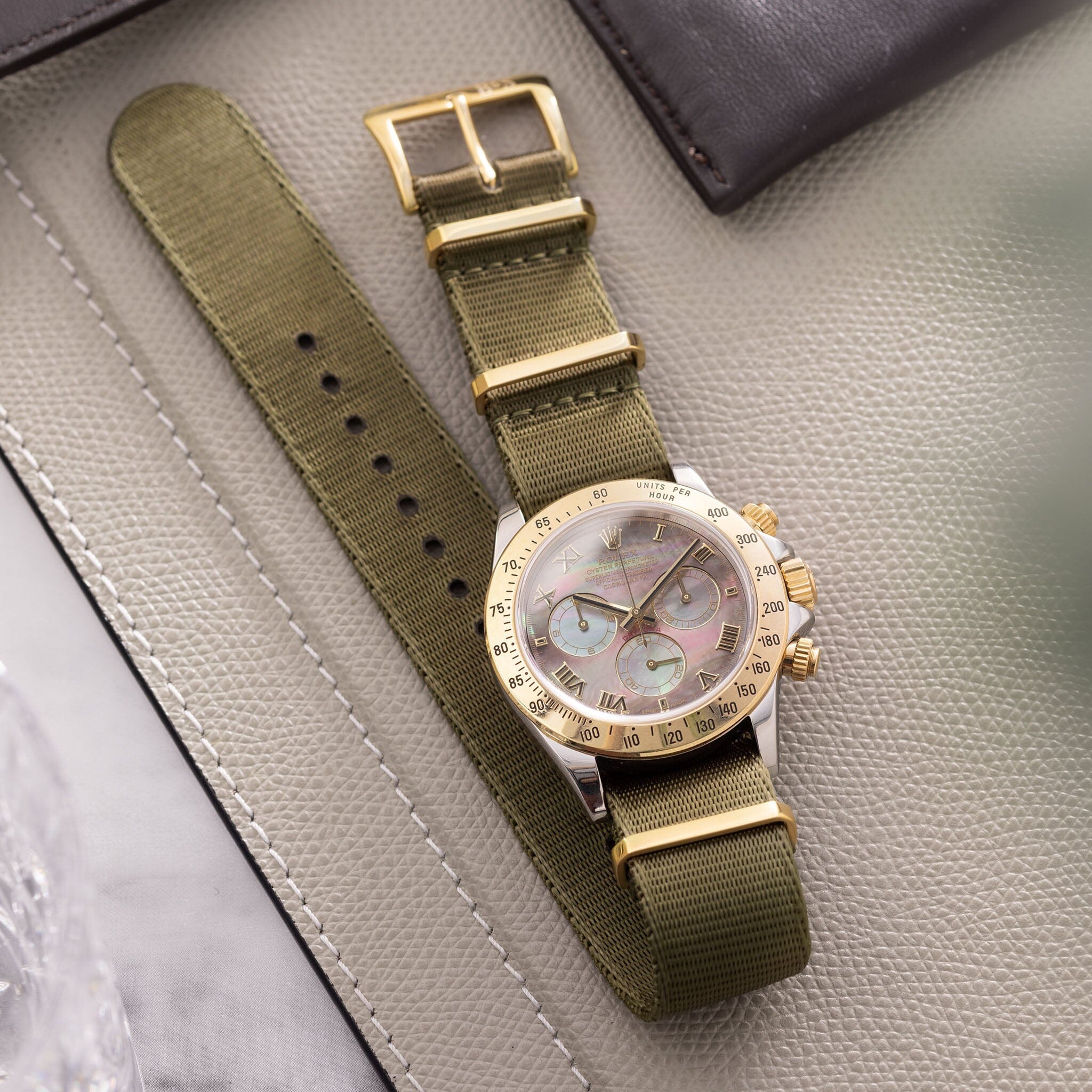 Gold watch sales green strap