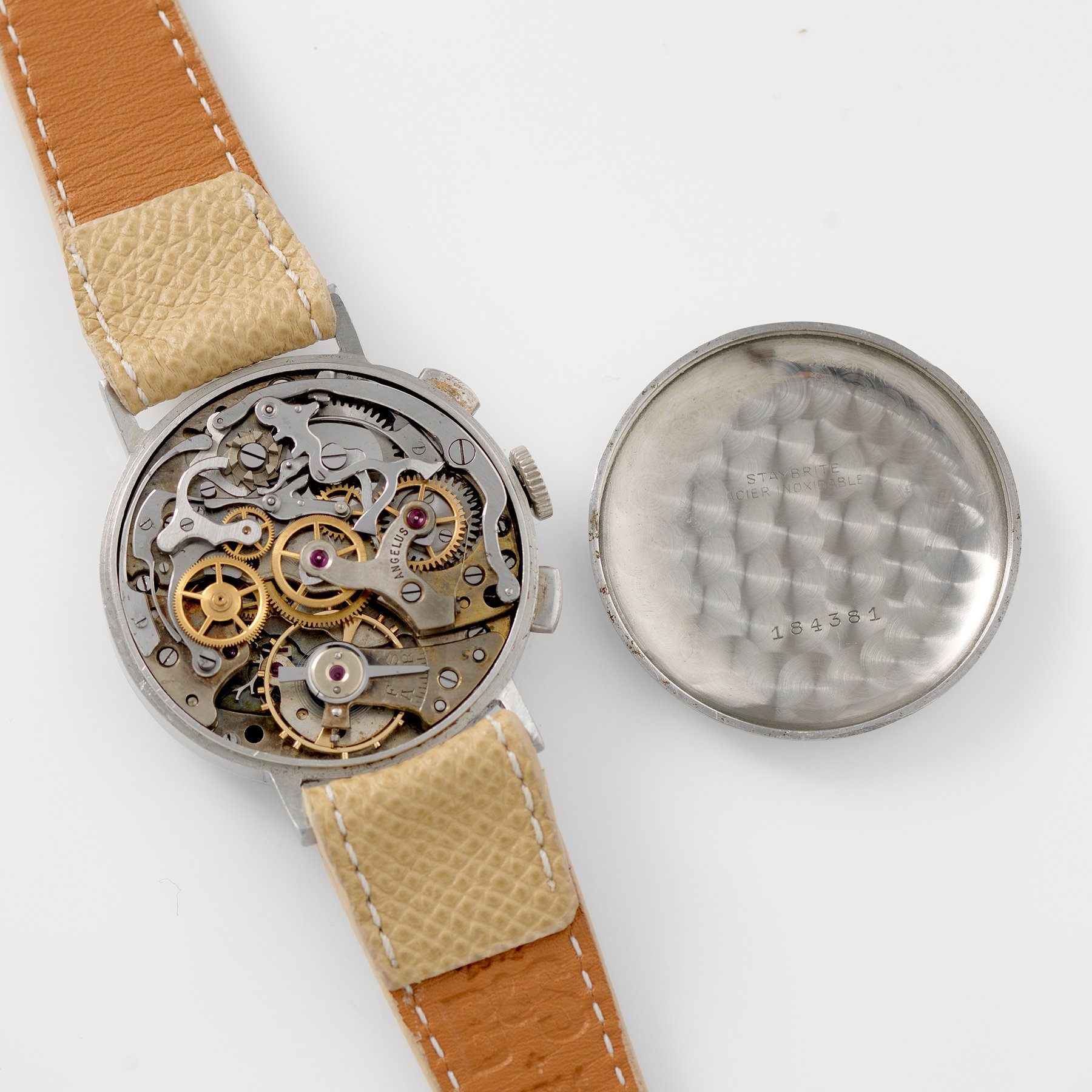 File:Detailed view on chronograph pushers and crown (with open watch  movement) of an Omega Cal. 1861 chronograph movement from an Omega  Speedmaster (cropped).jpg - Wikimedia Commons