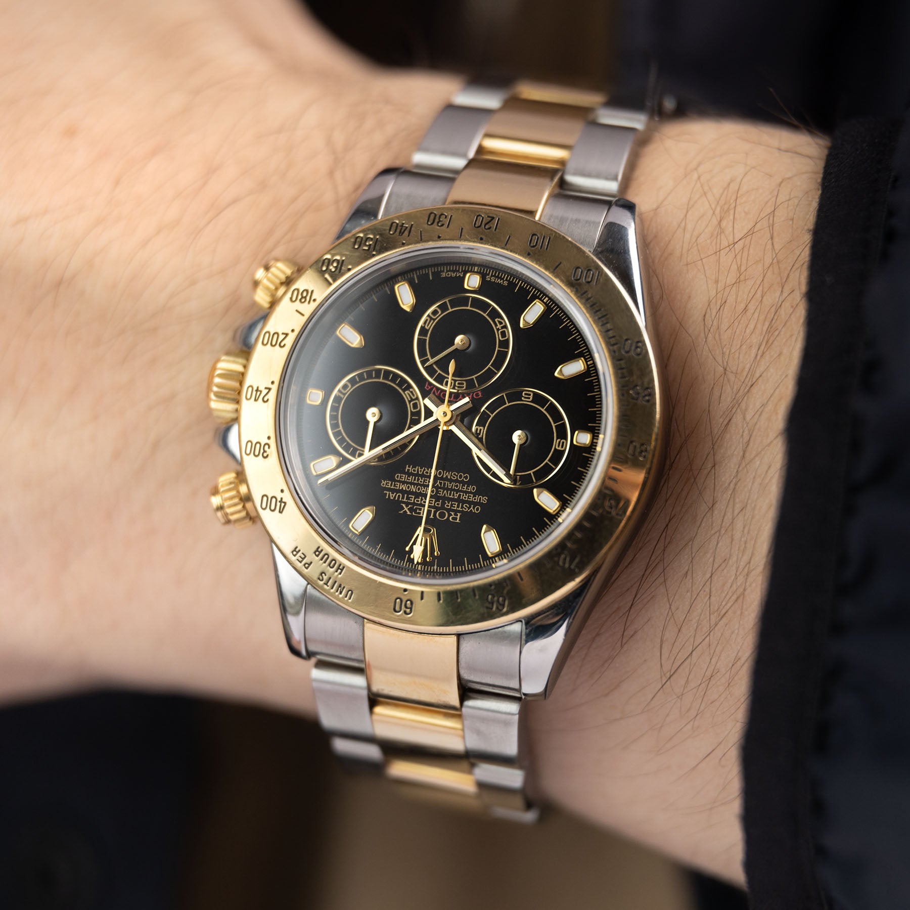 Rolex daytona steel 2025 gold black dial