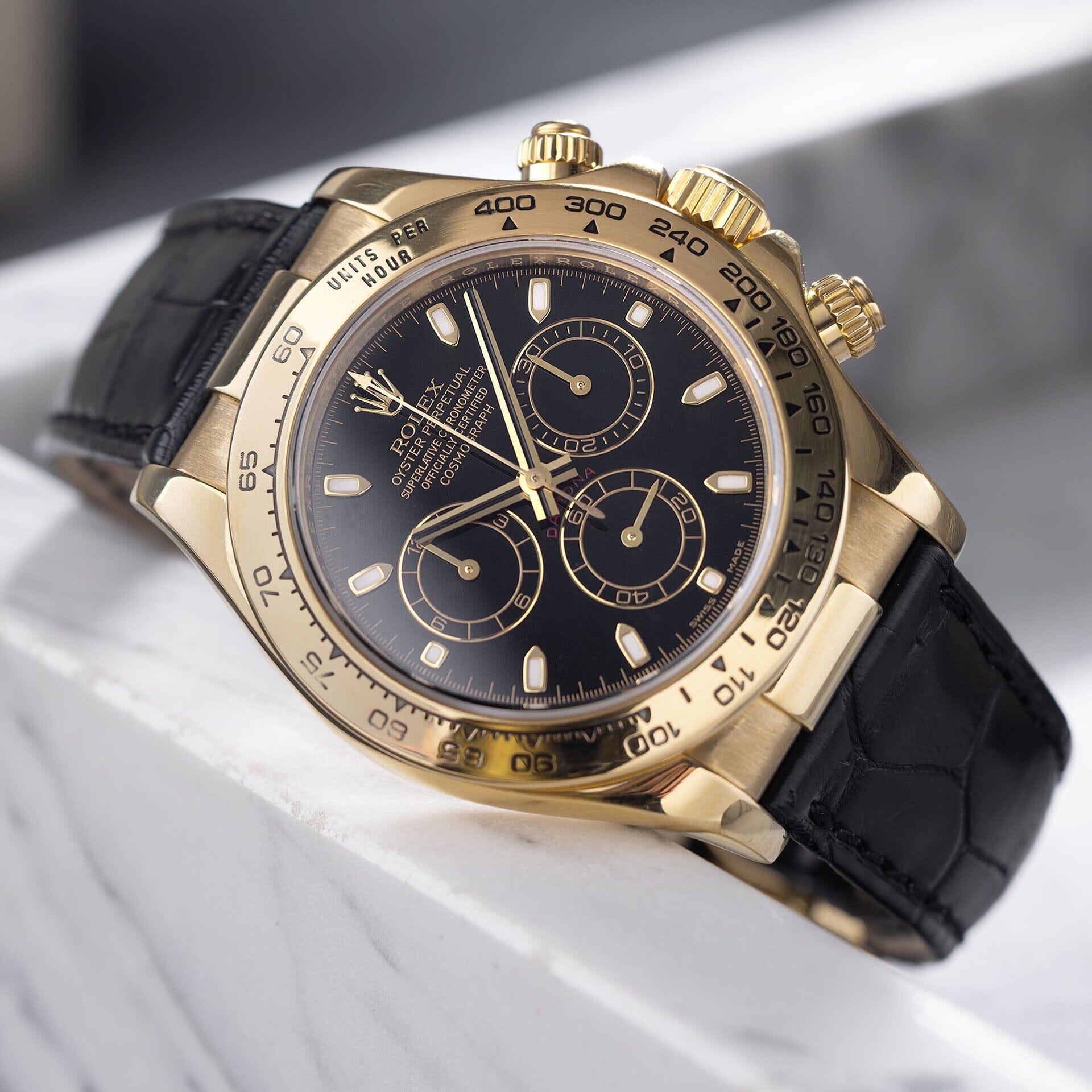 Rolex daytona clearance gold black face